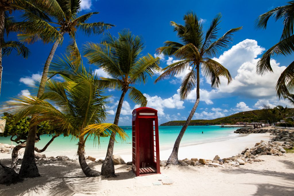 tropical palm trees and telephone booth, perfect beach, Dickenson Bay, Antigua