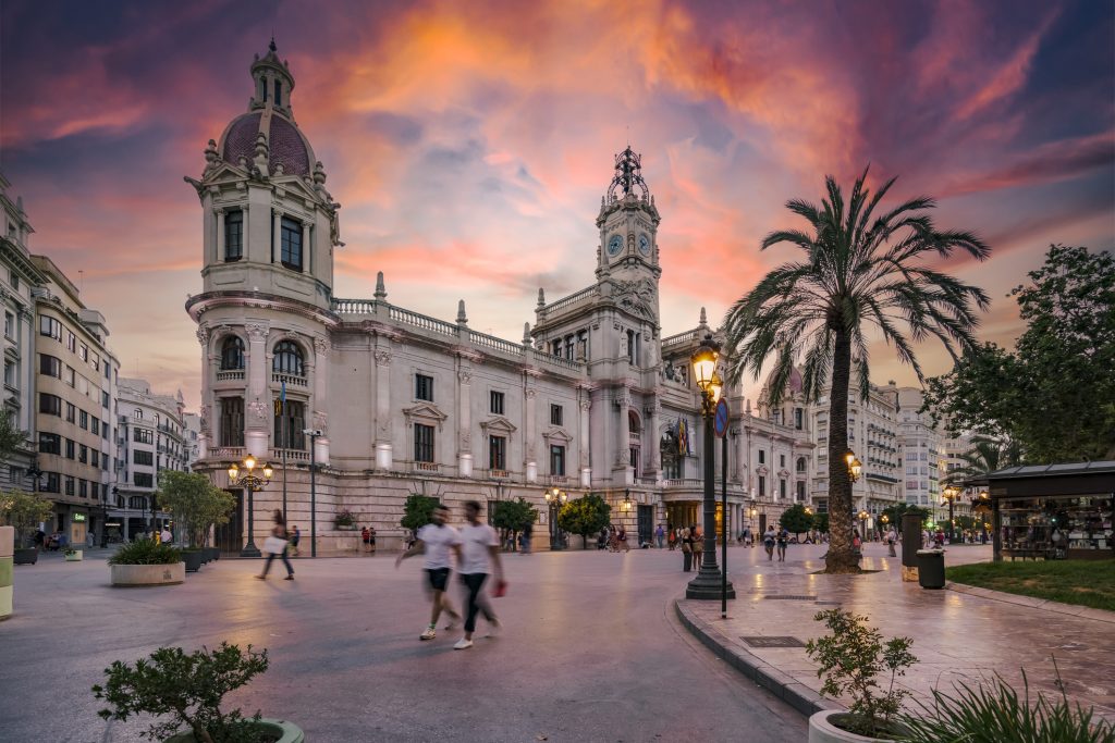 Plaza del Ayuntamiento in Valencia historic old town district during sunset Spain